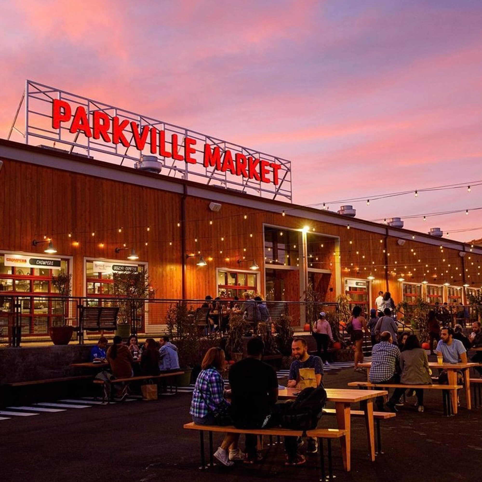 Parkville Market outdoor seating with a sunset.